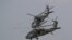 FILE - Two U.S. Black Hawk helicopters participate in a media demonstration.