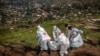 Members of the Congolese Red Cross carry body bags containing human remains during a mass burial for victims of the clashes in eastern Democratic Republic of Congo, at Musigiko cemetery in Bukavu on Feb. 20, 2025.