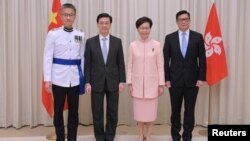 (左至右)新任警务处长萧泽颐，新任政务司司长李家超，特首林郑月娥，与新任保安局局长邓炳强出席宣誓仪式