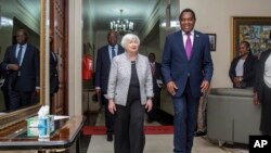 U.S. Treasury Secretary Janet Yellen walks with Zambia's President Hakainde Hichilema during their meeting at the State House in Lusaka, Zambia, Jan. 23, 2023. 