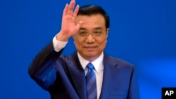 2014年3月13日中国国务院总理李克强在人民大会堂新闻发布会(资料照片)