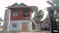 This newly built home belongs to Phel Hoeun's younger brother, who is migrating to work in Thailand, in order to pay off the loan they took to build this house, in Siem Reap province, August 2, 2019. (Khan Sokummono/VOA Khmer)