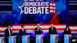 ការ​ជជែក​ដេញ​ដោល​នៃ​បេក្ខជន​ពី​គណបក្ស​ប្រជាធិបតេយ្យ រួម​មានអតីត​អនុប្រធានាធិបតី Joe Biden និង​ លោក​ស្រី Kamala Harris កាល​ពី​ថ្ងៃទី​២៧ មិថុនា ២០១៩។