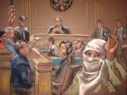 FILE - The jury foreman announcing the verdict at Aafia Siddiqui's trial in New York, Feb. 3, 2010.