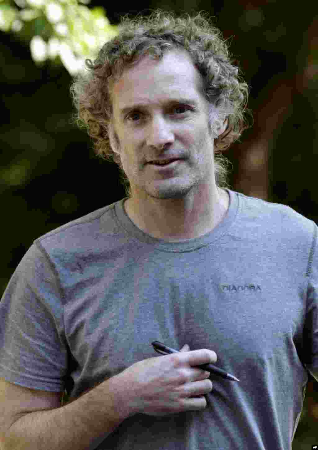 Peter Theo Curtis walks toward reporters to read a statement outside his mother's home in Cambridge, Massachusetts, Aug. 27, 2014. 