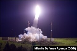 FILE - A Terminal High Altitude Area Defense (THAAD) interceptor is launched from the Pacific Spaceport Complex Alaska in Kodiak, Alaska, during Flight Test THAAD (FTT), 18 July 11, 2017.