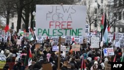 People supporting Palestine, take part in a protest against Israel, in front of the Israeli Embassy in Washington, DC, on March 2, 2024.