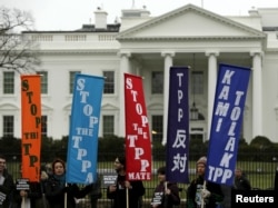 FILE - Opponents of the Trans Pacific Partnership (TPP) trade agreement protest outside the White House in Washington, Feb. 3, 2016.