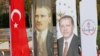 FILE - Banners with pictures of modern Turkey's founder Ataturk and Turkish President Tayyip Erdogan are pictured during the opening ceremony of Recep Tayyip Erdogan Imam Hatip School in Istanbul, Turkey, Sep. 29, 2017. 