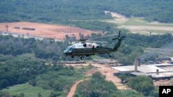 Marine One carrying President Joe Biden flies over the Amazon during a tour, Nov. 17, 2024, in Manaus, Brazil. 