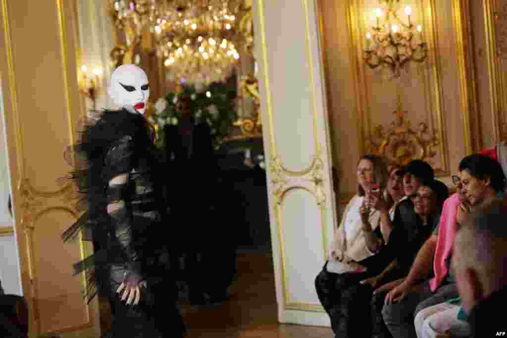 A model presents a creation by Matieres Fecales for the Womenswear Ready-to-wear Fall-Winter 2025/2026 collection as part of the Paris Fashion Week, in Paris.