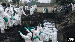 Members of the Congolese Red Cross and Civil Protection bury dozens of victims of the recent clashes in a cemetery in Goma on Feb. 4, 2025. 