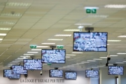 A sign reading "The law is equal for everyone" is pictured before a trial against 355 suspected members of the 'Ndrangheta' mafia, accused of an array of charges, in a High Security Courthouse in Lamezia Terme, Italy, Jan. 13, 2021.