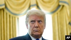 Presiden Donald Trump di Ruang Oval Gedung Putih di Washington, 7 Desember 2020. (Foto: AP)