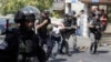 Israeli border police officers detain a Palestinian during clashes in Jerusalem, July 21, 2017.