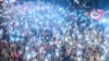 FILE - Supporters use flashlights on their cell-phones as they listen to presidential candidate of Turkey's main opposition Republican People's Party (CHP) Muharrem Ince (unseen) during an election campaign rally in Istanbul on June 9, 2018. 