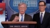 John Bolton, Penasihat Keamanan Nasional AS didampingi Menkeu Steve Mnuchin mengumumkan sanksi ekonomi AS terhadap Venezuela di Gedung Putih (28/1). 