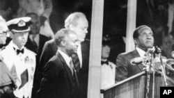 During the Independence celebrations, on April 18, 1980, Prime Minister Robert Mugabe takes the oath of allegiance to Zimbabwe in Highfields, Harare, Zimbabwe.