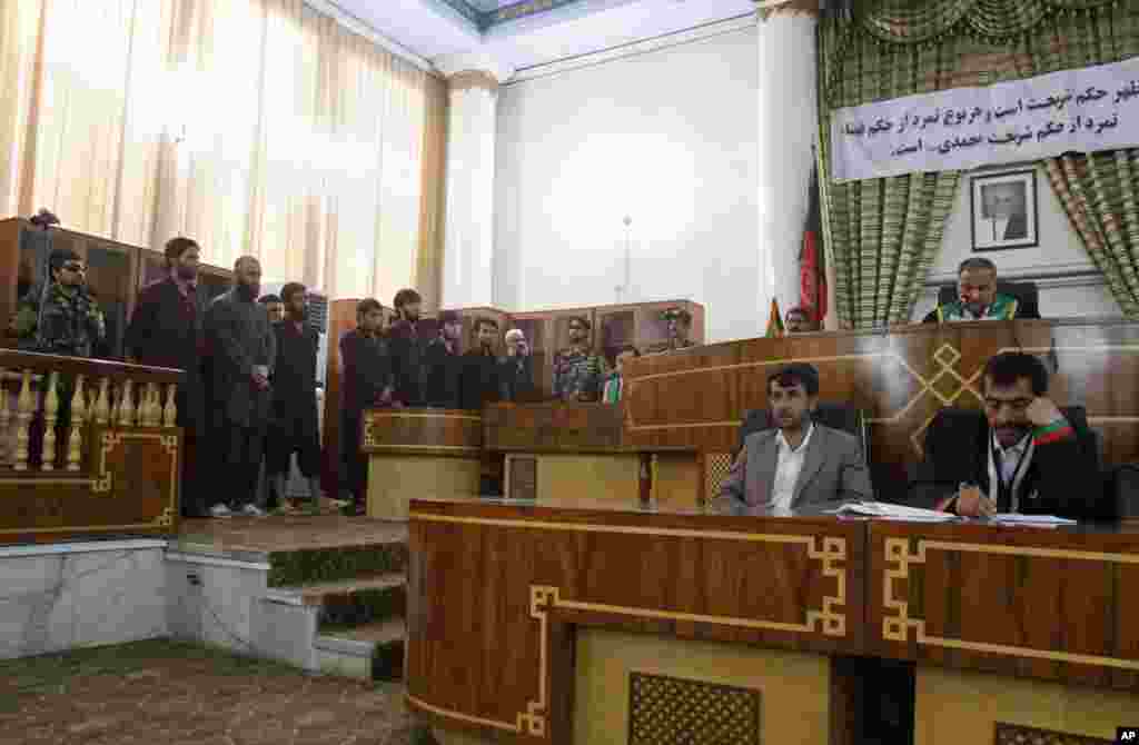 Defendants attend their trial at the Primary Court in Kabul, Afghanistan, Wednesday, May 6, 2015.