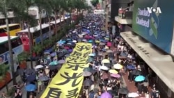 数以万计港人继续大游行抗议港府强推禁蒙面法