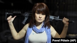 RUSSIA -- Maria Butina, a gun-rights activist, poses for a photo at a shooting range in Moscow, April 22, 2012.