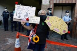 Pro-democracy activist Alexandra Wong attents a protest for the release of 12 Hong Kong activists and Zhang Zhan in Hong Kong on December 28, 2020.