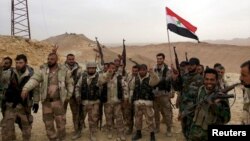 Vojne snage predsednika Bašara al Asada slave zauzimanje delova Palmire u Siriji, 26. mart 2016.