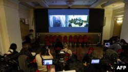 Jailed Russian opposition figure Alexei Navalny is seen on a screen via a video link from the IK-3 penal colony above the Arctic circle during a hearing at the Supreme Court in Moscow, Jan. 11, 2024.