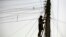 FILE - An Afghan man repairs electricity cables along the streets of Kabul, Nov. 16, 2009. The country is negotiating for an increase in energy supplies from its Central Asian neighbors.