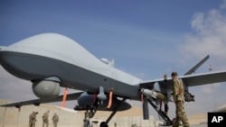 Американський дрон MQ-9 під час авіашоу на аеродромі Кандагар, Афганістан, 23 січня 2018 р. AP Photo/Massoud Hossaini