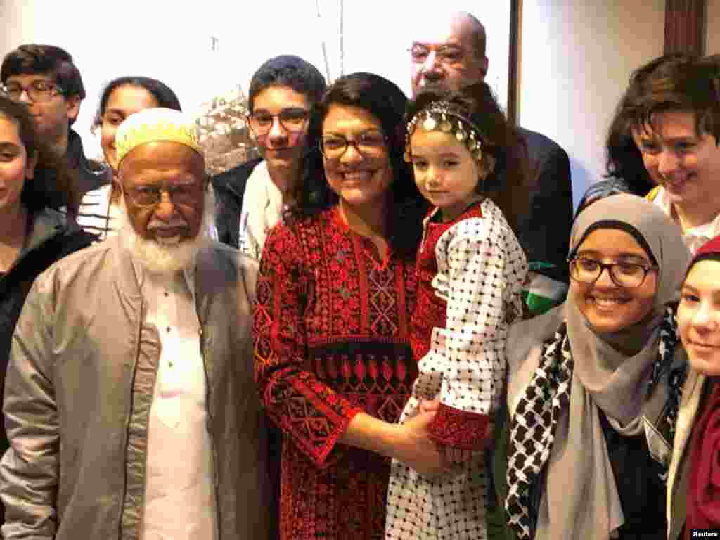 Congresswoman Rashida Tlaib (D-MI), the first Palestinian-American elected to the House, poses with supporters outside her office at the Longworth House Office Building (LHOB), in Washington, D.C., Jan. 3, 2019.