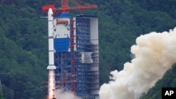 A Long March 2-C rocket carrying an astronomical satellite blasts off from the Xichang Satellite Launch Center in southwestern China's Sichuan Province on June 22, 2024. (Xinhua News Agency via AP)