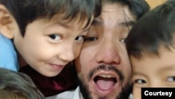 Idris Hasan is pictured with his children before he left for Morocco in 2020 from Turkey. (Courtesy - Zeynure Obul)