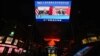 A screen displays a CCTV state media news broadcast showing Chinese President Xi Jinping and U.S. President Joe Biden during a virtual summit, in Beijing, China, Nov. 16, 2021.