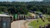 FILE - Trucks wait in a line on the road to enter Uganda in Malaba, a city bordering with Uganda, western Kenya, April 29, 2020. (AFP)