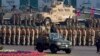 FILE - Pakistan's President Mamnoon Hussain, center on a military vehicle, reviews a military parade to mark Pakistan's Republic Day, in Islamabad, Pakistan, March 23, 2017. 