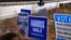 Campaign signs for Republican presidential nominee former President Donald Trump and Democratic presidential nominee Vice President Kamala Harris, line a highway, Oct. 31, 2024, in Barrington, N.H.