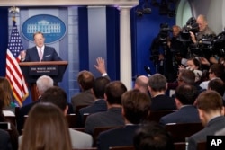 FILE - Then-White House press secretary Sean Spicer speaks during the daily press briefing at the White House in Washington, May 12, 2017.