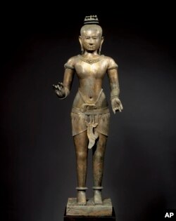 This March 2007 photo shows a bronze sculpture titled "Standing Shiva" at the Metropolitan Museum of Art in New York. The sculpture will be returned to Cambodia or Thailand.