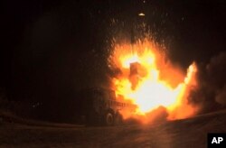 In this photo provided by South Korea Defense Ministry, South Korea's Hyunmoo II missile is fired during an exercise at an undisclosed location in South Korea, Nov. 29, 2017.