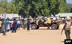 Soldiers and security block a road as they secure the venue during a rally of the ruling People's Democratic Party (PDP) in Maiduguri, Nigeria, Jan. 24, 2015.