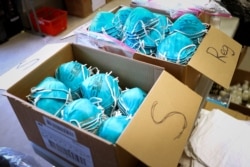 FILE PHOTO: Boxes of N95 protective masks for use by medical field personnel are seen at a New York State emergency operations incident command center during the coronavirus outbreak in New Rochelle, New York, March 17, 2020.