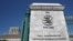 FILE - A logo is pictured on the headquarters of the World Trade Organization in Geneva, Switzerland, June 2, 2020. 