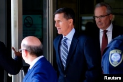 Former U.S. National Security Adviser Michael Flynn departs U.S. District Court, where pleaded guilty to lying to the FBI about his contacts with Russia's ambassador to the United States, in Washington, Dec. 1, 2017.