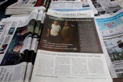 FILE - The final issue of The Cambodia Daily is sold at a newsstand, in Phnom Penh, Cambodia, Monday, Sept. 4, 2017. When Cambodia’s main opposition leader was arrested over the weekend in a surprise police raid, one of this country’s last independent media outlets rushed reporters out in the middle of the night to cover the story, just as it has done for nearly a quarter-century. But the English-language Cambodia’s Daily’s reportage about the arrest of Kem Sokha, who stands accused by the government of treason, was a tragic story in and of itself: It was on the front page of the paper’s final issue Monday. (AP Photo/Heng Sinith)