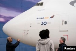 Boeing employees and members of the media attend the delivery of the final 747 jet at the Boeing plant in Everett, Washington, US Jan. 31, 2023.