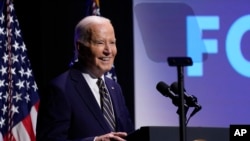 FILE - U.S. President Joe Biden speaks at the National Museum of African American History and Culture in Washington, May 17, 2024. He plans to travel to Africa next week.