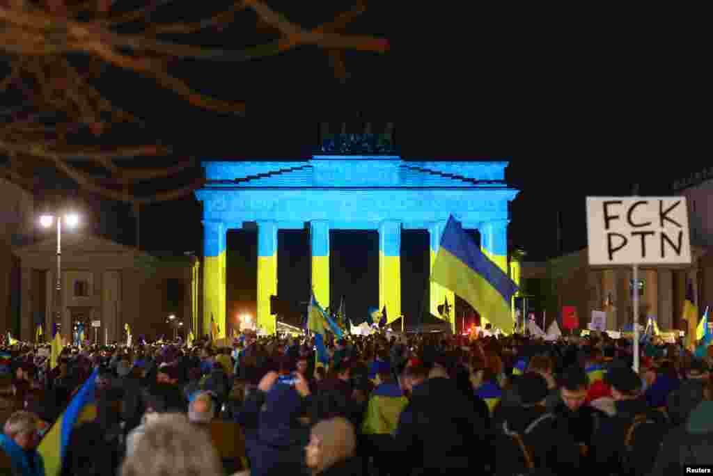 Ukraine supporters gather to mark the third anniversary of Russia's invasion of Ukraine, near Berlin's Brandenburg Gate, in Berlin, Germany.
