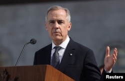 마크 카니 캐나다 신임 총리가 2025년 3월 14일 온타리오주 오타와의 리도 홀에서 취임 선서식을 마친 후 기자들의 질문에 답하고 있다.