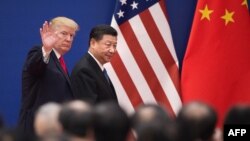 U.S. President Donald Trump and China's President Xi Jinping leave a business leaders event at the Great Hall of the People in Beijing, Nov. 9, 2017.